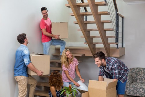 Commercial relocation team preparing office items for transport near West Hampstead