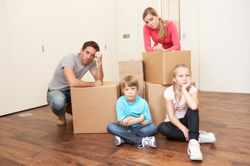Careful unloading of household items at a West Hampstead property